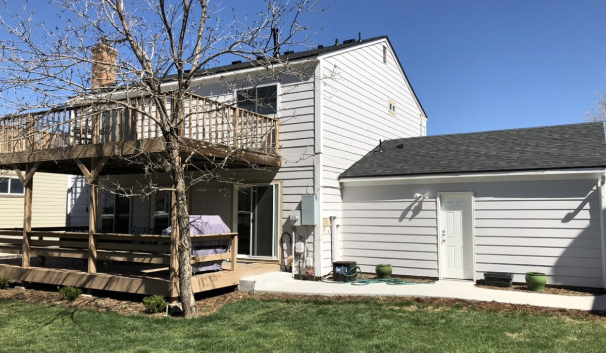Crisp, clean lines for a beautiful two-story residential update. This project featured a complete roof and garage replacement using dimensional shingles that perfectly complement the home's modern white siding and outdoor living spaces.