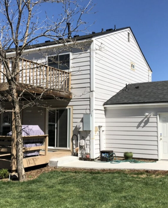 Crisp, clean lines for a beautiful two-story residential update. This project featured a complete roof and garage replacement using dimensional shingles that perfectly complement the home's modern white siding and outdoor living spaces.